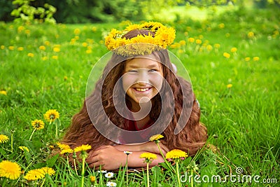 Summer portrait of a merry child with dandelions flowers. Stock Photo