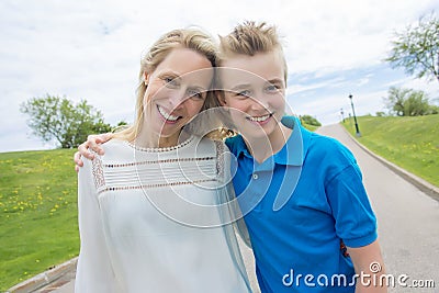 Summer portrait of mother and son outside on a road Stock Photo