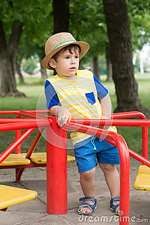 Summer portrait toddler boy in straw hat. Stock Photo