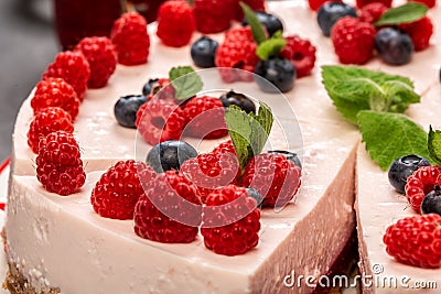 Summer raspberry and blueberry no bake cheesecake, Food recipe background Stock Photo