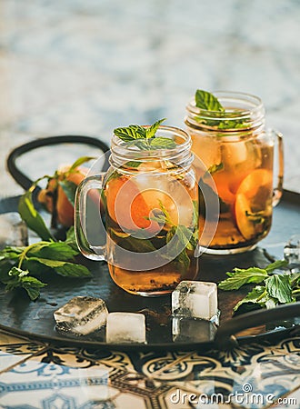 Summer refreshing cold peach ice tea with mint, copy space Stock Photo