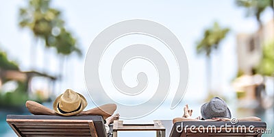 Summer resort hotel stay relaxation with tourist traveller couple take it easy happily resting on beach chair on holiday travel Stock Photo