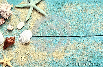 Summer sea background. Starfish, seashells and sand on a wooden blue background Stock Photo