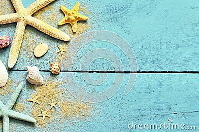 Summer sea background. Starfish, seashells and sand on a wooden blue background Stock Photo