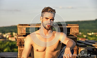 Summer season. Fitness model. Sexy pensive man relaxing outdoors. Muscular body. Muscular chest. Muscular bare torso Stock Photo