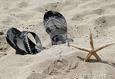 Summer shoes on the beach and starfish Stock Photo