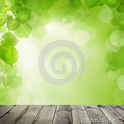 Summer Soft Focus Background with Abstract Green and Yellow Bokeh and Empty Wooden Board with Copy space Stock Photo