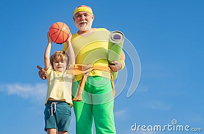 Summer sport and fun lifestyle. Sports education. Grandpa and grandson spotting. Father and child training together. I Stock Photo