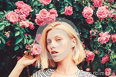 Summer and spring park nature. natural beauty. Spa and skincare. rose flower smell. Parfume. beautiful woman with blonde Stock Photo