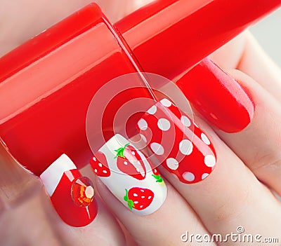 Summer style red manicure with strawberries and polka dots Stock Photo