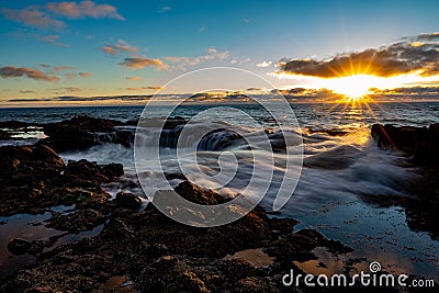 Summer Sunset falling on the Oregon Coast at Thor`s Well Stock Photo