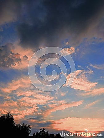 summer sunset and voluminous clouds Stock Photo