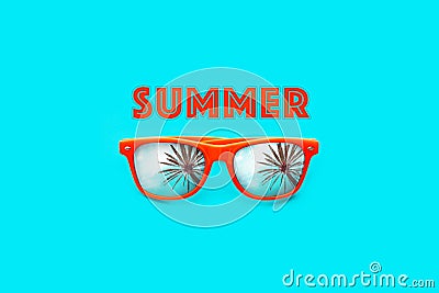 Summer text and orange sunglasses with palm tree reflections isolated in large cyan background. Minimal image concept Stock Photo