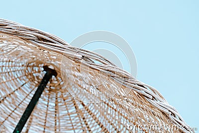 Summer texture and background. Wicker lattice roof of beach umbrella. Stock Photo