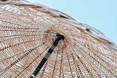Summer texture and background. Wicker lattice roof of beach umbrella. Stock Photo