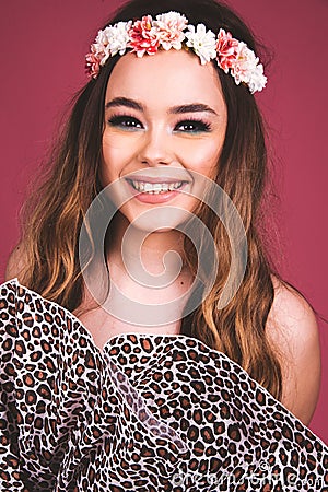 Summer time exotic floral portrait of young beautiful woman with long hair and hair flowers accessorize Stock Photo