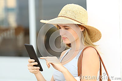 Summer tourist checking mobile phone Stock Photo