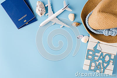 Summer travel concept. Decorative airplane, passports, hat and seashells. Stock Photo