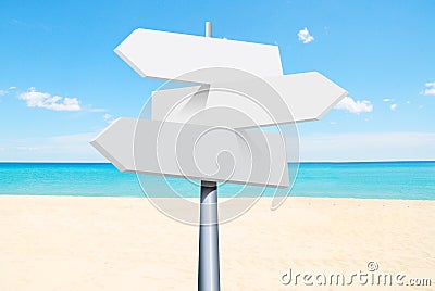 summer travel destinations options. Direction road sign with arrows on beach and sea Stock Photo