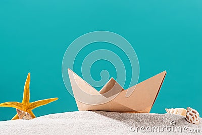 Summer traveling concept. Origami paper boats over blue background. Stock Photo