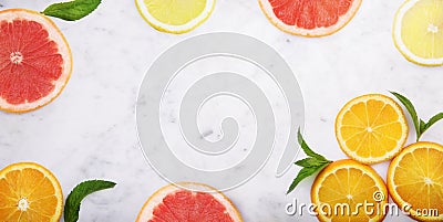 Summer tropical juice concept with lemon, grapefruit and orange on luxury marble kitchen table. Flat lay. Fresh smoothie beverage Stock Photo