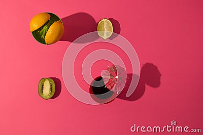 Summer tropical layout made with fresh fruit on pink background. Minimal natural scene Stock Photo