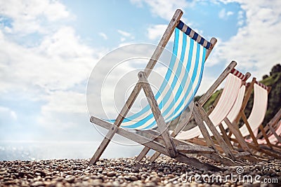 Summer vacation deck chairs on the beach at the seaside Stock Photo
