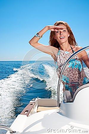 Summer vacation - girl driving a motor boat Stock Photo