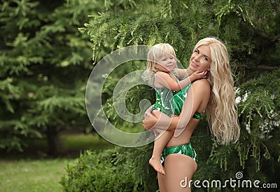 Summer vacations family look, blond girls parenthood portrait. B Stock Photo