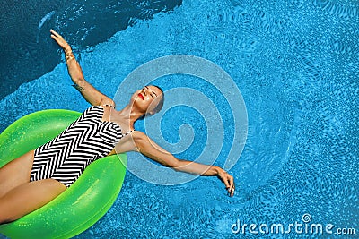 Summer Vacations. Woman Sunbathing, Floating In Swimming Pool Water Stock Photo