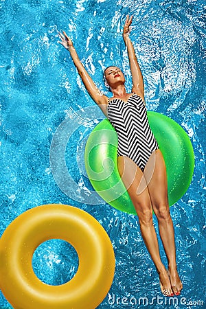 Summer Vacations. Woman Sunbathing, Floating In Swimming Pool Water Stock Photo