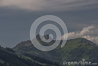 Summer valley with Grossarler Ache small river and blue cloudy sky Stock Photo