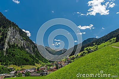 Summer valley with Grossarler Ache small river and blue cloudy sky Stock Photo