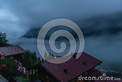 Summer valley morning with fog with Grossarler Ache river and blue cloudy sky Stock Photo