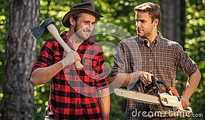 Summer vibes. deforestation. ranger or poach. man forester use saw and axe. search firewood for picnic campfire Stock Photo