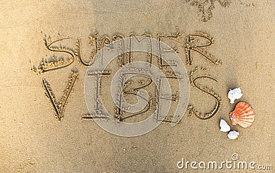 Summer vibes written in the sand Stock Photo