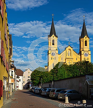 Bruneck street overlooking medieval church of Santa Maria Assunta Stock Photo