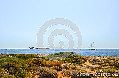 Ship wreck `Nordland` and yacht, Diakofti Kythera, Greece. Stock Photo