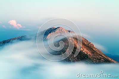 Formation and movement of clouds over mountains peaks. Stock Photo