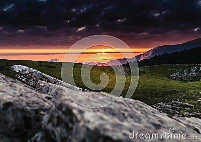 vivid landscape in the mountains at sunrise Stock Photo