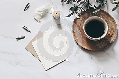 Summer wedding stationery mock-up scene. Blank greeting cards, wooden plate, envelope, ribbon, cup of coffee and olive Stock Photo