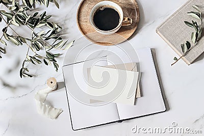 Summer wedding stationery scene. Open diary and blank greeting card mockups. Cup of coffee wooden plate, book, ribbon Stock Photo