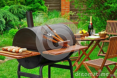 Summer Weekend BBQ Scene With Charcoal Grill On The Backyard Stock Photo