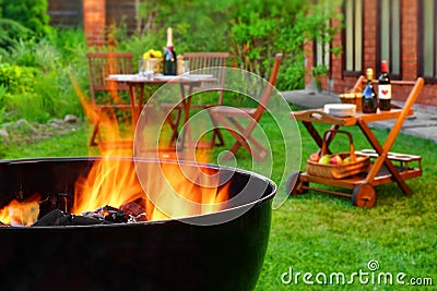 Summer Weekend BBQ Scene With Grill On The Backyard Garden Stock Photo