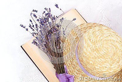 Summer weekend concept. I read the novel and rest. Opened book, lavender and straw hat, top view. Provence and Rustic style. Organ Stock Photo