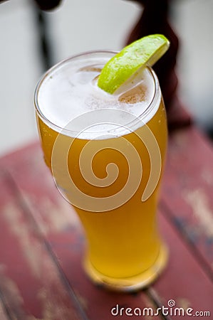 Summer wheat beer with lime Stock Photo