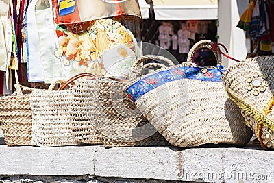 Summer wicker bags made of straw and rattan on the market in Taormina, Sicily, Italy Stock Photo