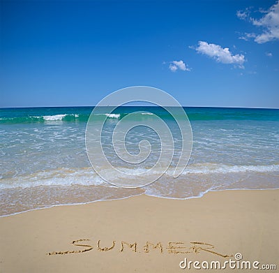 Summer written in beach sand Stock Photo