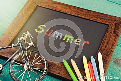 Summer - written with crayons on the chalkboard Stock Photo