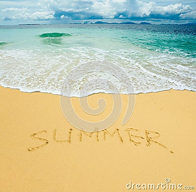 Summer written in a sandy beach Stock Photo